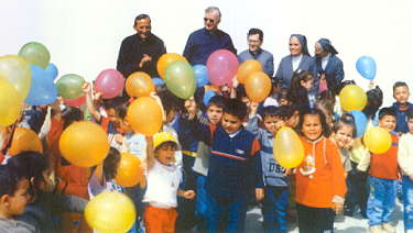 Fr Chavez among the children